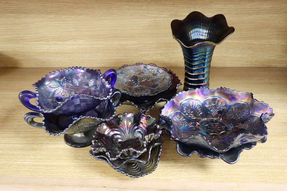 A group of ten dishes and vases in blue lustre Carnival glass, tallest 22cm